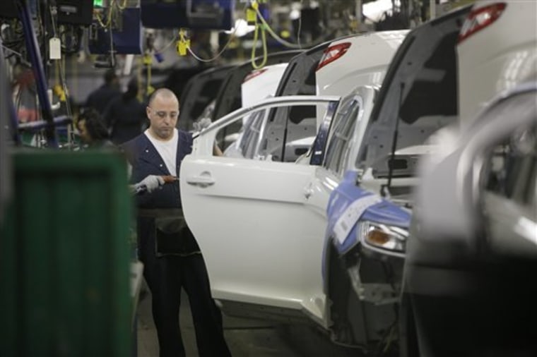 Workers man the assembly line of Ford Motor Co.'s Chicago Assembly Plant on Jan. 26 in Chicago. A new poll shows that more Americans now say U.S.-made automobiles are better quality than cars made by Asian manufacturers.
